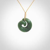This picture shows a koru pendant, hand carved from New Zealand jade. We will provide this with an adjustable plaited cord. This has been hand carved by Kyohei Noguchi. One only pendant, shipped to you with express courier.